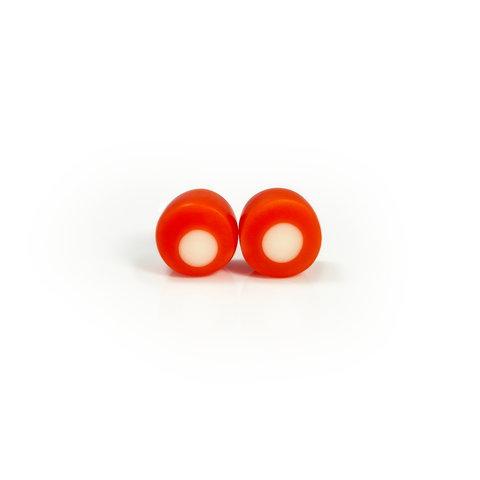 Tangerine orange resin stud earrings inlaid with a white dot. Fitted with Sterling silver pins.