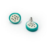 oval shaped resin stud earrings, the middle is cream with black polka dots, the edges are turquoise, fitted with silver pins and plastic disc backs