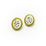 oval shaped resin stud earrings, the middle is cream and inlaid with polka dots, the edges are lime green, fitted with silver pins