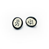 black and white resin stud earrings, the middle is cream and inlaid with polka dots, the edges are black, fitted with silver pins