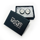 the black and white stud earrings displayed in Tiki gift box