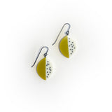 Leaf shaped lime green and white resin drop earrings inlaid with black polka dots With oxidised silver hooks