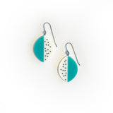 Large leaf shaped drop earrings cast in teal and white resin, and inlaid with black dots. With silver hooks.