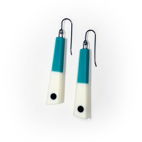 minimalist chopstick shaped earrings cast in teal and white resin, inlaid with a black dot. Fitted with oxidised silver hooks.