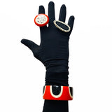 Orange resin cuff bracelet and 2 chunky resin rings worn on model's arm