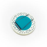 The surgical steel back fitment from the oversized disc resin brooch.