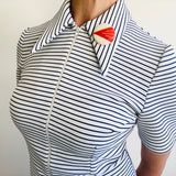 geometric brooch seventies dress