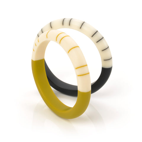 Designer handmade slim bracelets cast in lime, black and ivory resin and inlaid with minimalist stripes