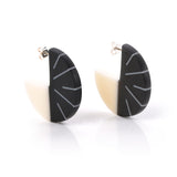 Designer geometric disc earrings handmade from black and white resin. Fitted with silver pins and butterfly backs.