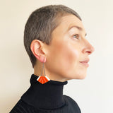 Orange and ivory Art Deco drop earrings handmade from resin. Hooks and chain are Sterling silver.