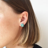 model wearing teal and white Zazou circle stud earrings