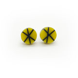 Geometric resin Zazou circle stud earrings cast in mustard yellow, inlaid with black