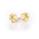 Geometric resin Zazou circle stud earrings cast in white, inlaid with mustard green