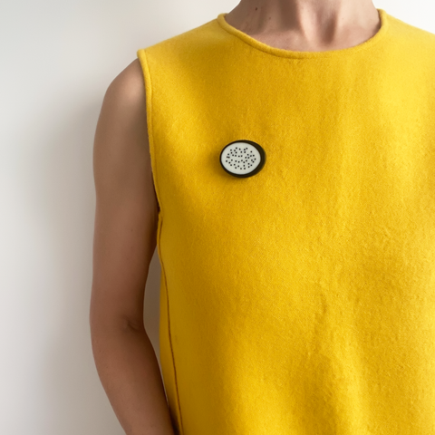 Polka dots minimalist brooch worn by model