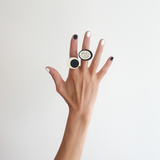 Model hand wearing 2 Monochrome polka dots statement rings