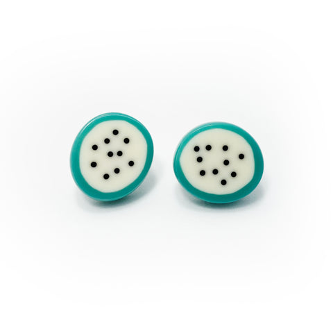 oval resin stud earrings with teal border and a cream polka dot centre