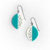 Leaf shaped resin earrings cast in teal blue and white resin, and inlaid with black polka dots. Fitted with oxidised silver hooks.