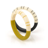 Designer handmade slim bracelets cast in lime, black and ivory resin and inlaid with minimalist stripes