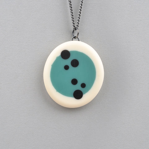 blue and white round resin pendant inlaid with black polka dots