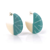 Modernist disc hoop earrings, handmade from turquoise blue and white resin. Fitted with silver pins and butterfly backs.