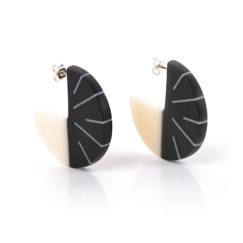 Designer geometric disc earrings handmade from black and white resin. Fitted with silver pins and butterfly backs.