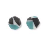 Faceted geometric stud earrings handmade from turquoise blue and black offcuts, cast in ivory white resin.