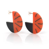 Modernist disc hoop earrings cast in read and black resin, fitted with silver pins