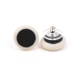 black and white minimalist round stud earrings handmade from resin; fitted with silver pins and comfortable pads backs