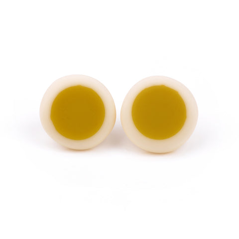 minimalist circular stud earrings handmade from lime and white resin; a lime green circle is set in a fine ivory resin edge