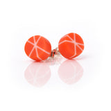 Geometric resin Zazou stud earrings cast in orange and white