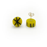 Geometric resin Zazou circle stud earrings cast in mustard yellow, inlaid with black