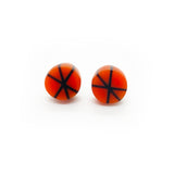 Geometric resin Zazou circle stud earrings cast in orange, inlaid with black