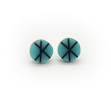 Geometric resin Zazou circle stud earrings cast in blue, inlaid with black