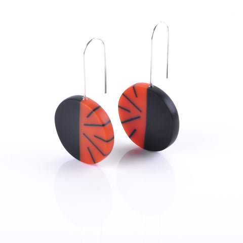 red and black circle earrings handmade from resin and silver