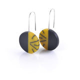 mustard and black resin and silver disc earrings