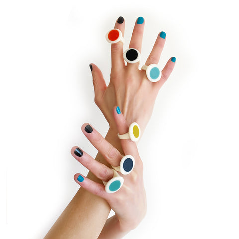 Model hands wearing multiple pebble shaped Nabu statement rings