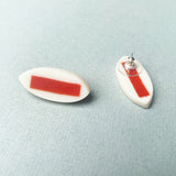 red and white leaf resin stud earrings with earring post displayed